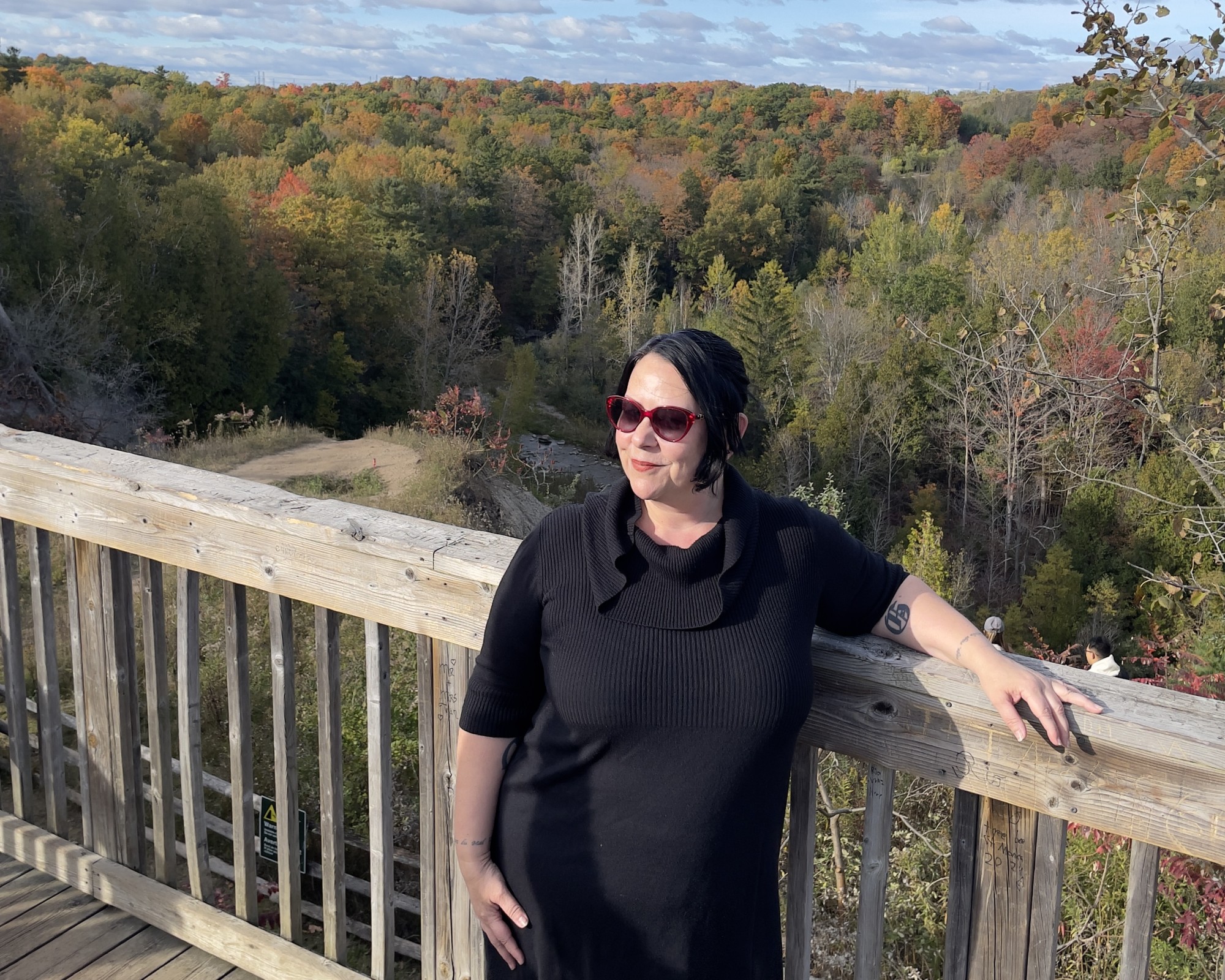 Woman posing with fall colours in Rouge Park