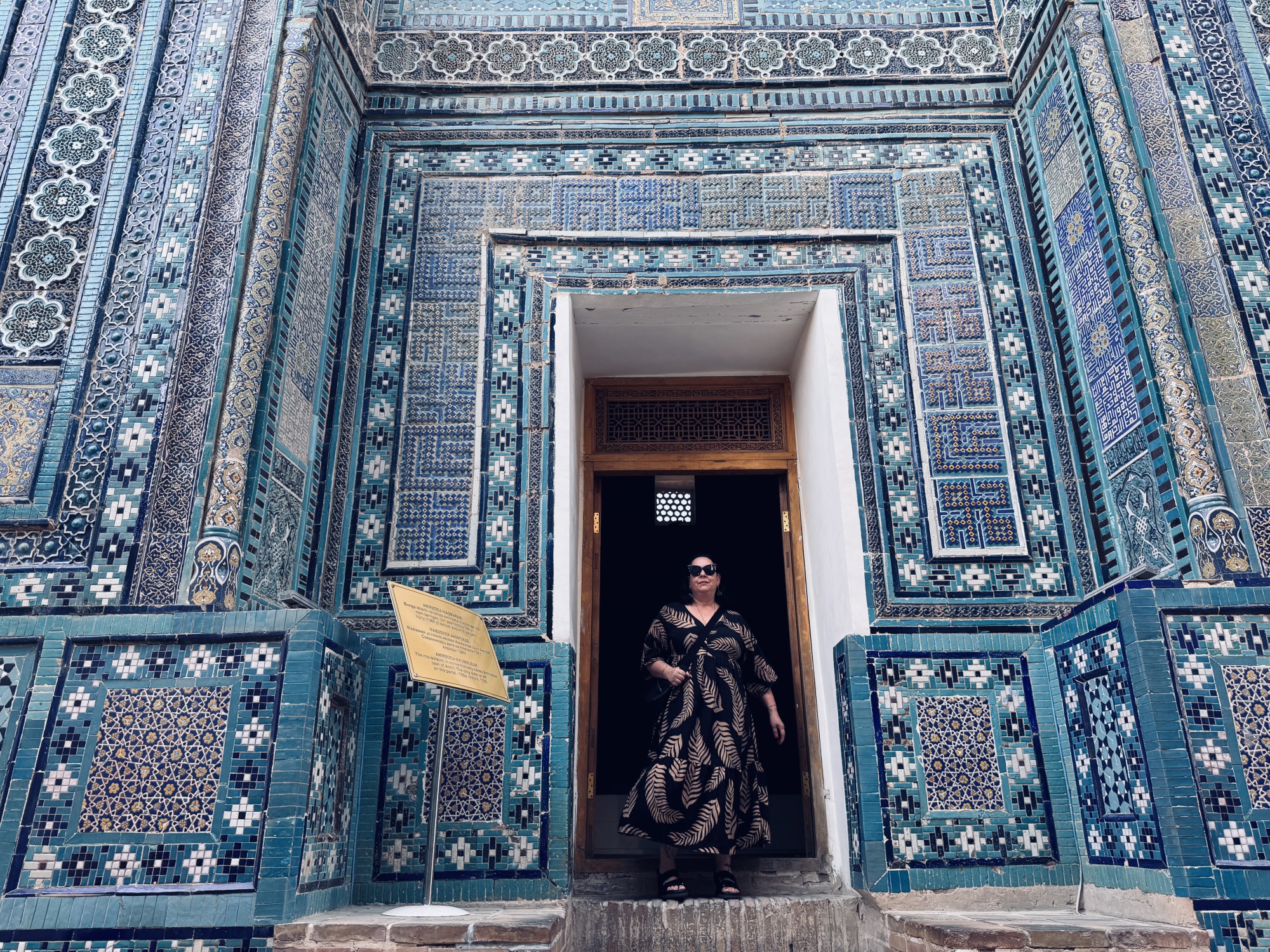 Posting in door surrounded by blue tiles in Samarkand